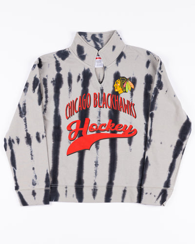 youth girl pullover with distressed all over print and Chicago Blackhawks wordmark and primary logo on front - front lay flat 