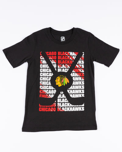 Chicago Blackhawks youth tee with wordmark graphic and primary logo on crossed hockey sticks - front lay flat