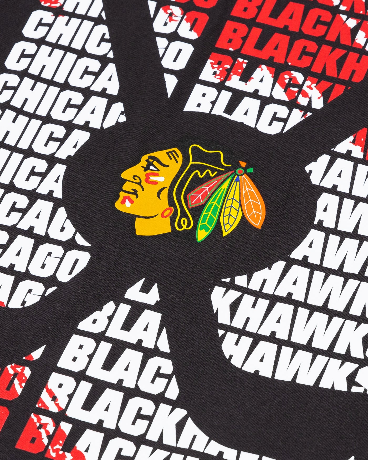 Chicago Blackhawks youth tee with wordmark graphic and primary logo on crossed hockey sticks - detail lay flat