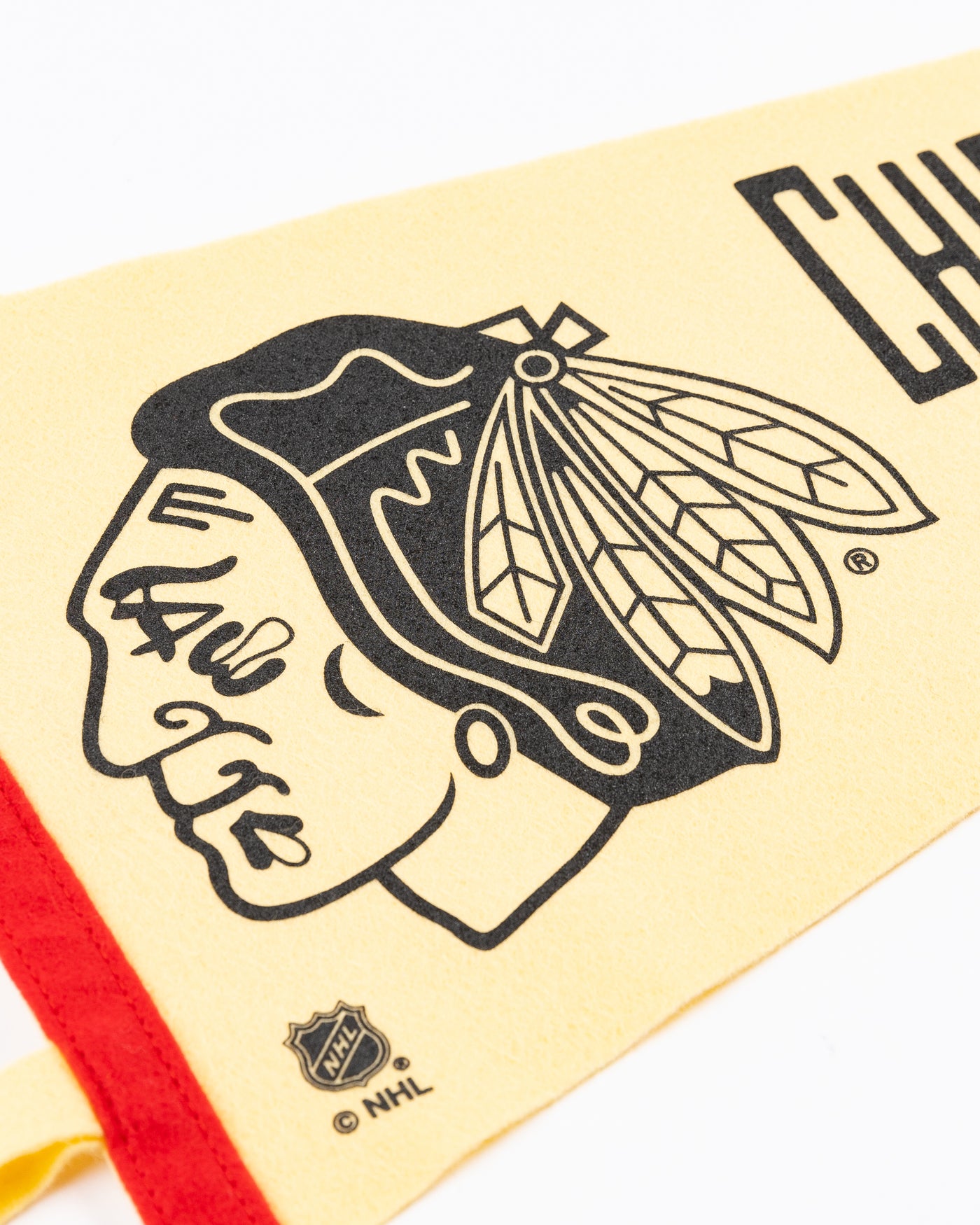 cream Oxford Pennant with Chicago Blackhawks primary logo and wordmark - detail lay flat