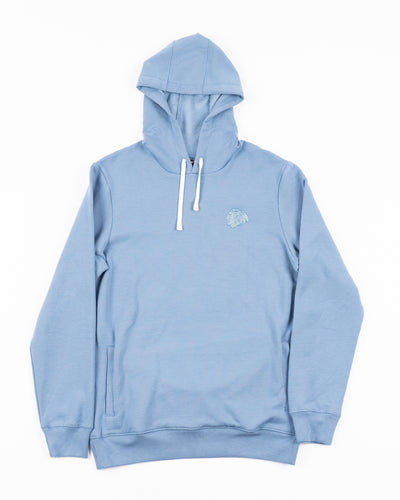 light blue TravisMathew hoodie with Chicago Blackhawks tonal primary logo embroidered on left chest - front lay flat