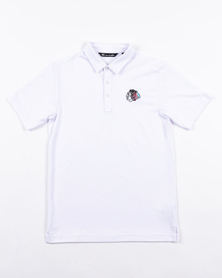 white TravisMathew polo with tonal Chicago Blackhawks primary logo embroidered on left chest - front lay flat