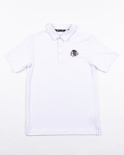 white TravisMathew polo with tonal Chicago Blackhawks primary logo embroidered on left chest - front lay flat