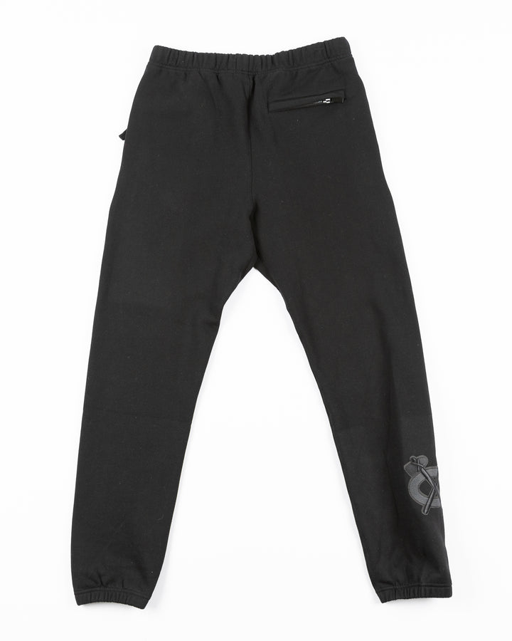 black Pro Standard sweatpants with Chicago Blackhawks embroidered tonal logos on legs - back lay flat