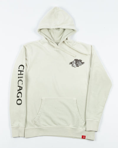 off white Sportiqe hoodie with Chicago Blackhawks primary logo on left chest and Chicago wordmark on right arm - front lay flat