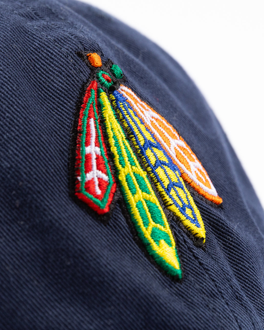 navy '47 brand adjustable cap with Chicago Blackhawks four feathers logo embroidered on front and UIC logo on right side - front detail lay flat