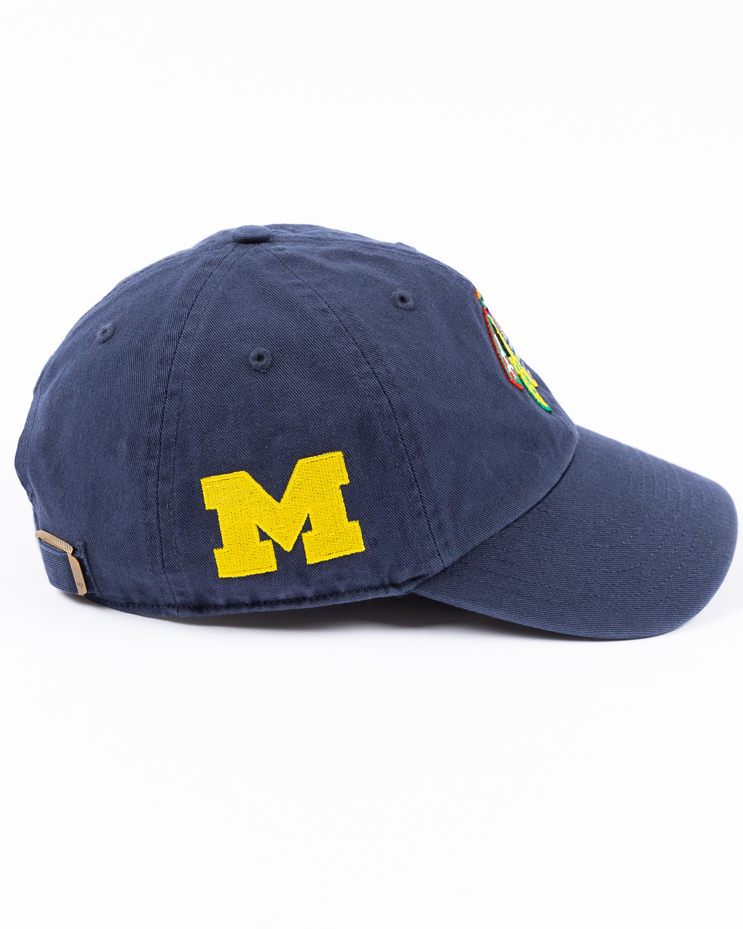 navy '47 brand adjustable hat with Chicago Blackhawks four feather logo embroidered on front and University of Michigan logo embroidered on right side - right side lay flat