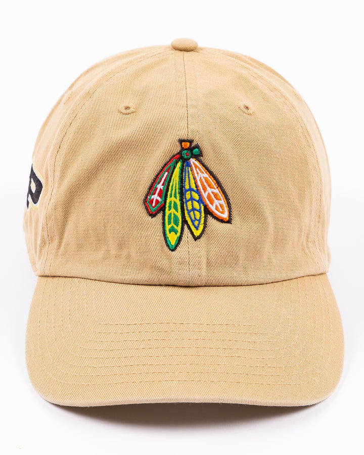 khaki '47 brand adjustable cap with Chicago Blackhawks four feathers logo embroidered on front and Purdue University logo embroidered on right side - front lay flat