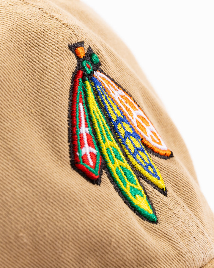 khaki '47 brand adjustable cap with Chicago Blackhawks four feathers logo embroidered on front and Purdue University logo embroidered on right side - four feathers detail lay flat