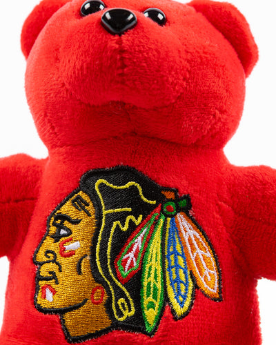 small red plush bear with embroidered Chicago Blackhawks primary logo on front - detail lay flat