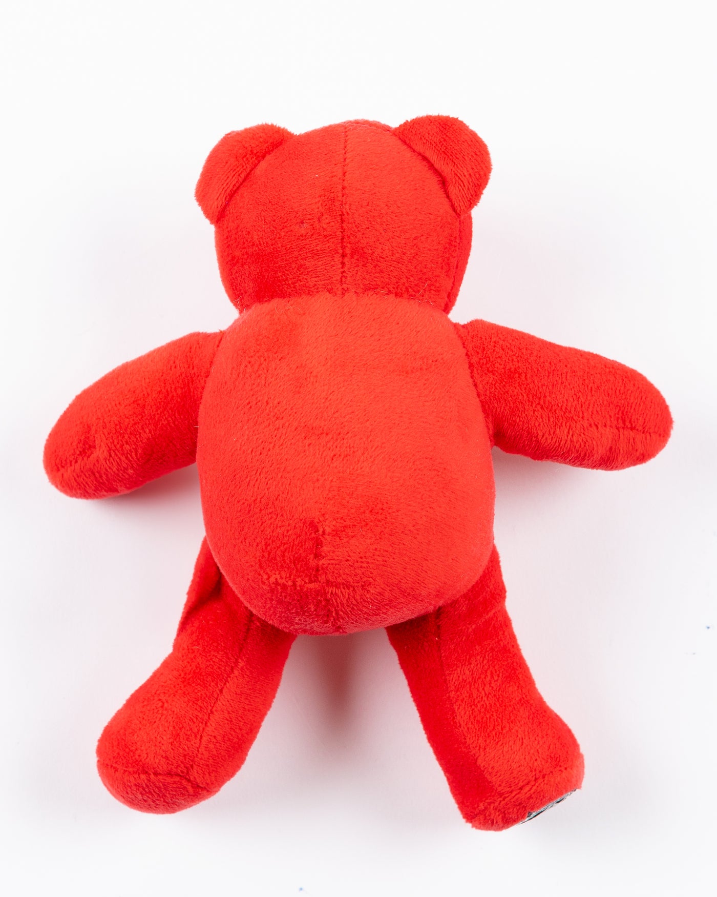 small red plush bear with embroidered Chicago Blackhawks primary logo on front - back lay flat
