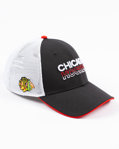 black and white Fanatics trucker with Chicago Hockey wordmark embroidered on front and Chicago Blackhawks primary logo embroidered on right side - right angle lay flat