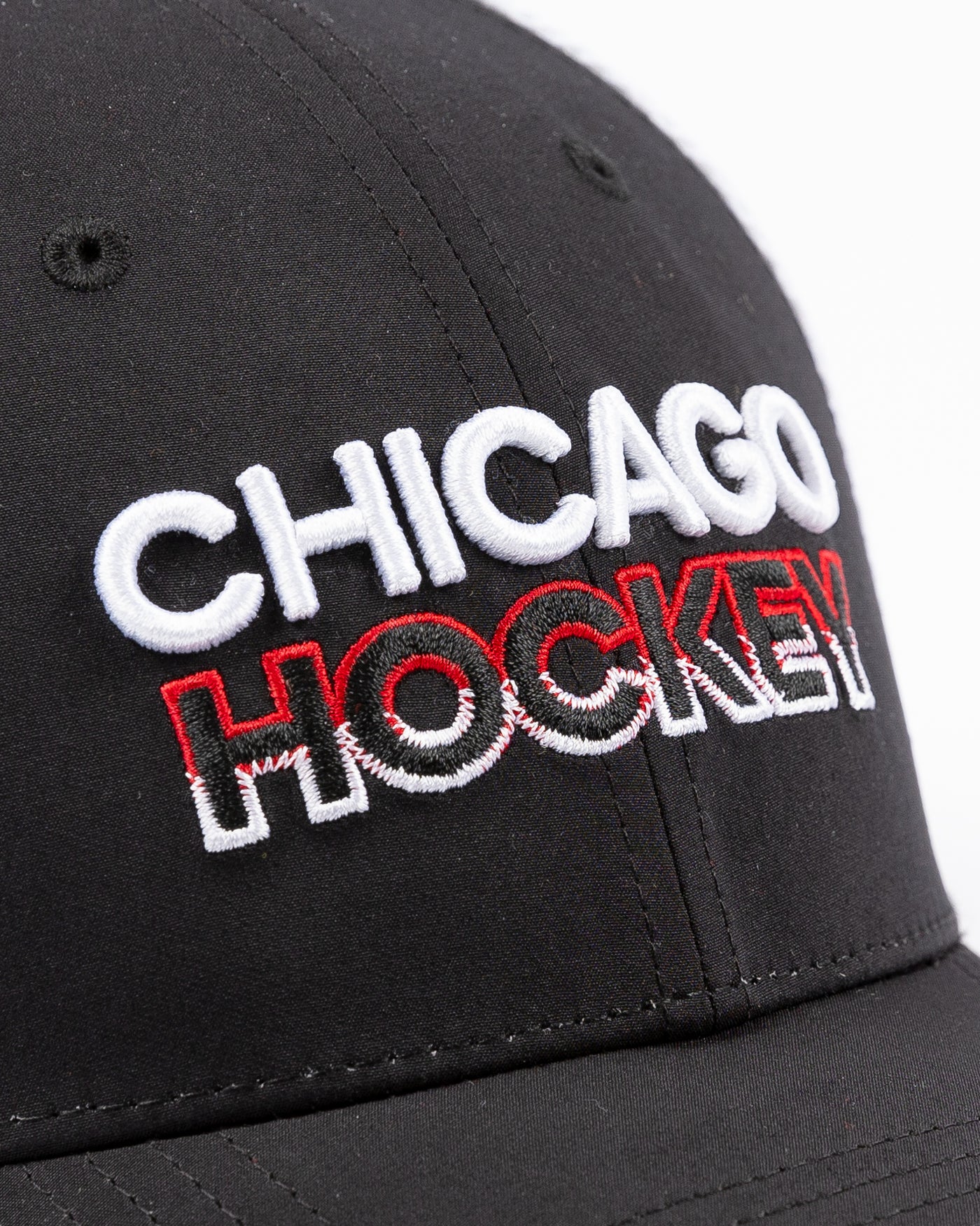 black and white Fanatics trucker with Chicago Hockey wordmark embroidered on front and Chicago Blackhawks primary logo embroidered on right side - detail lay flat