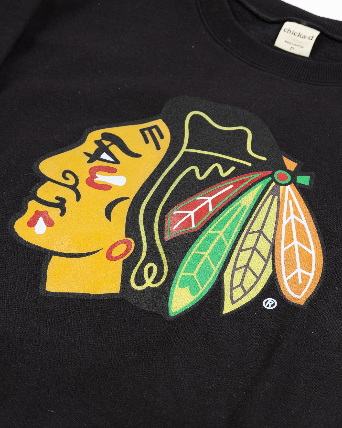 black ladies chicka-d crewneck with Chicago Blackhawks primary logo across chest - detail lay flat