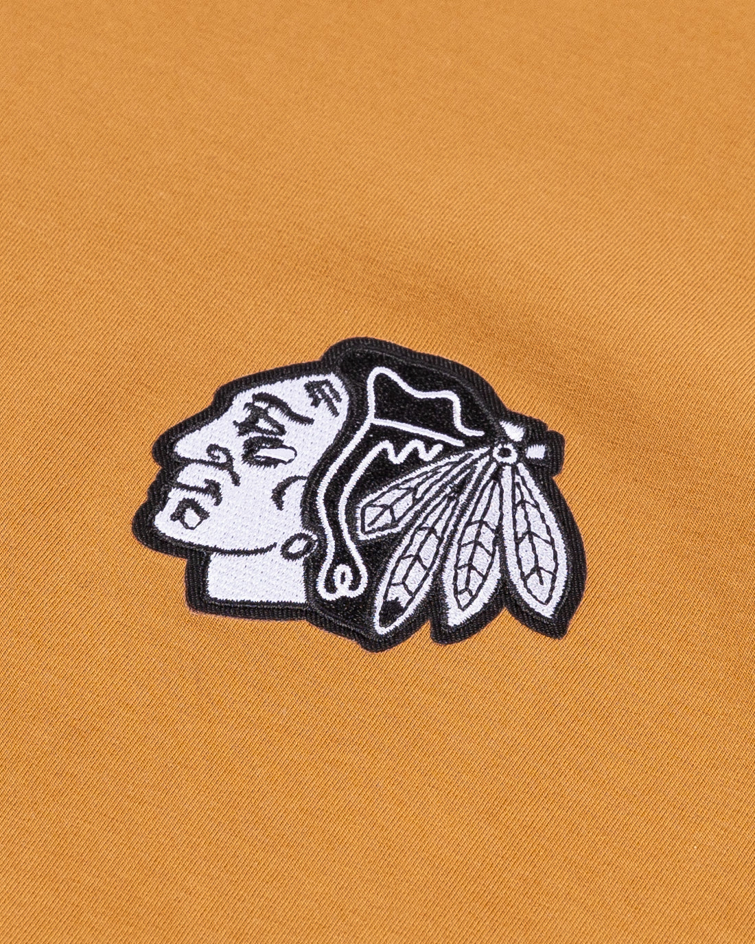 brown short sleeve CCM tee with Chicago Blackhawks tonal primary logo embroidered on left chest - detail lay flat