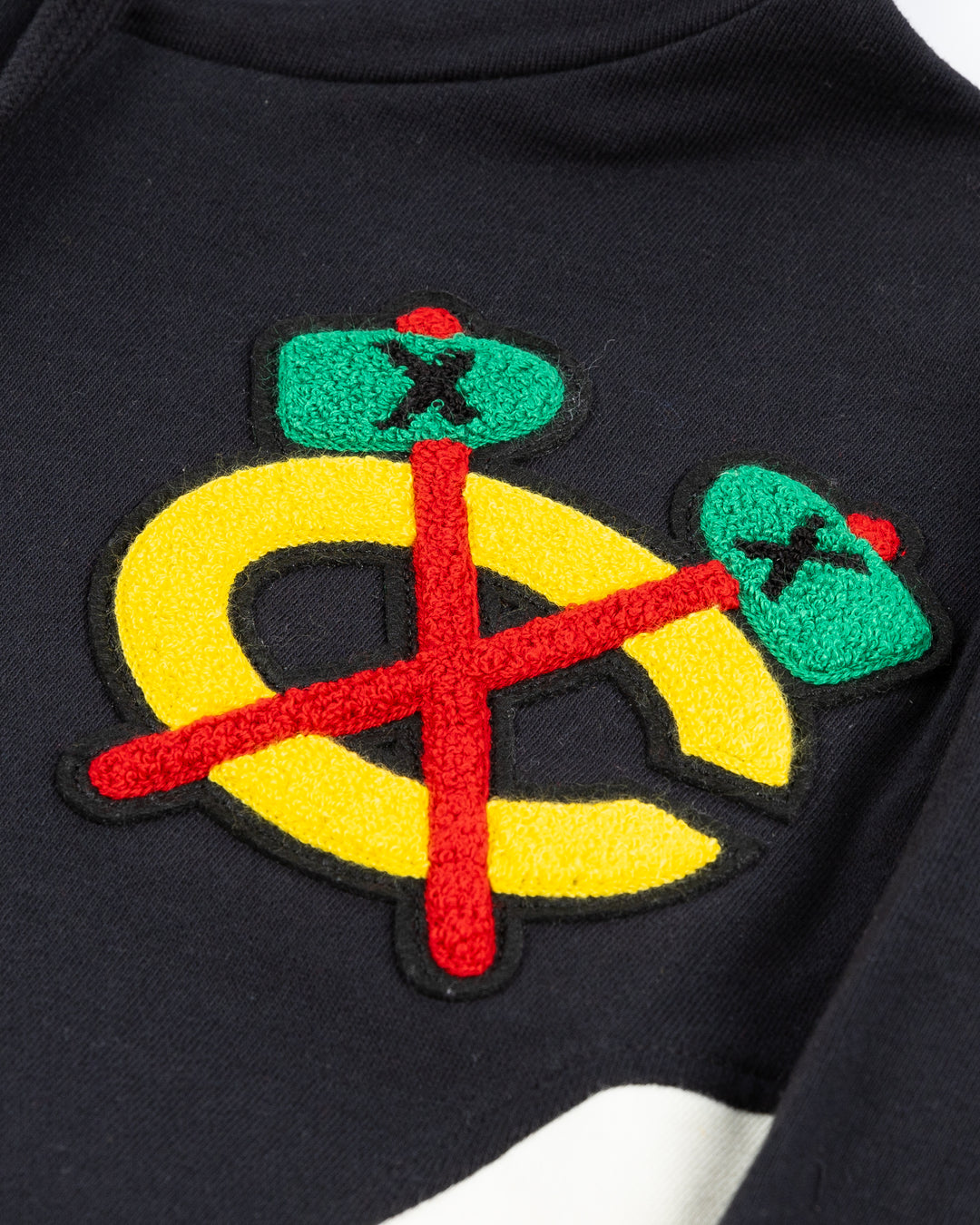 ribbed black Mitchell & Ness hoodie with embroidered chenille Chicago Blackhawks primary and secondary logos on chest - alt detail lay flat