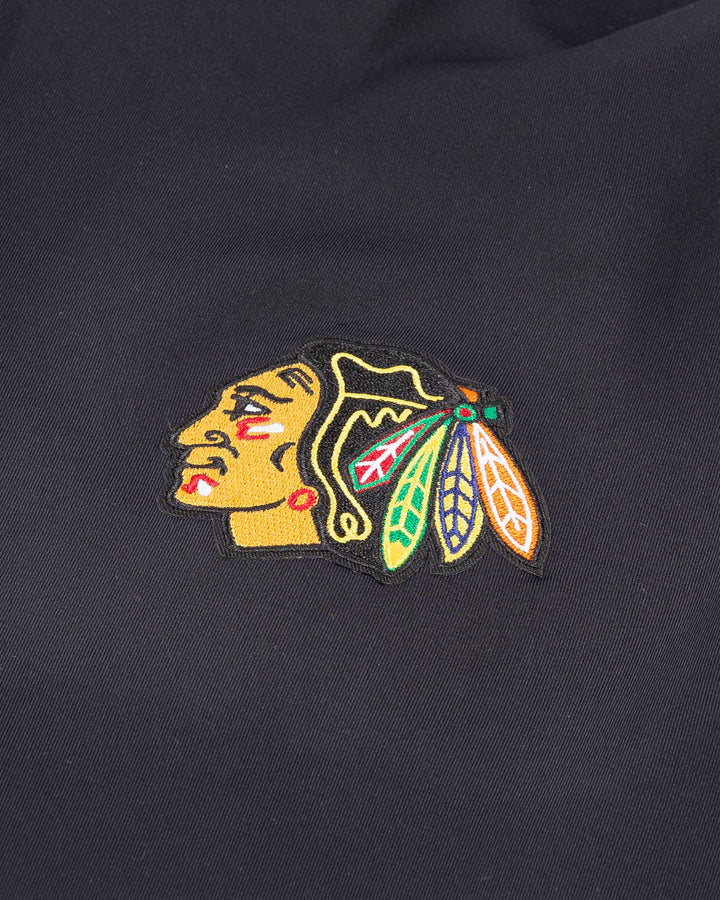 Antigua big and tall black Antigua quarter zip with embroidered Chicago Blackhawks primary logo on left chest - detail lay flat