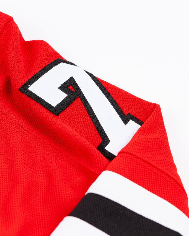 red adidas Chicago Blackhawks hockey jersey with Taylor Hall name and number - shoulder detail lay flat