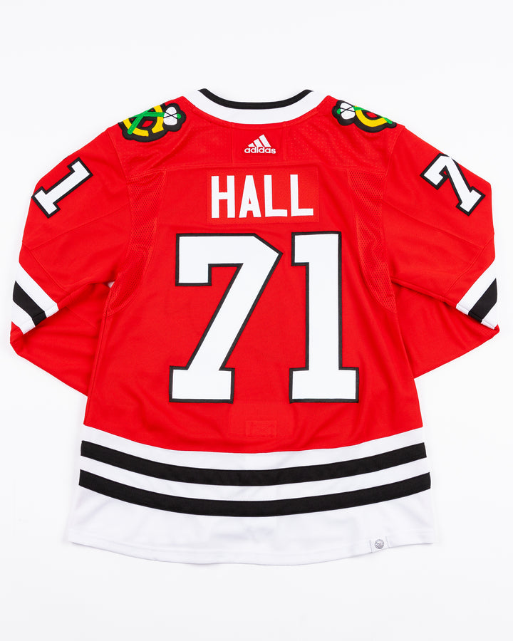 red adidas Chicago Blackhawks hockey jersey with Taylor Hall name and number - back lay flat