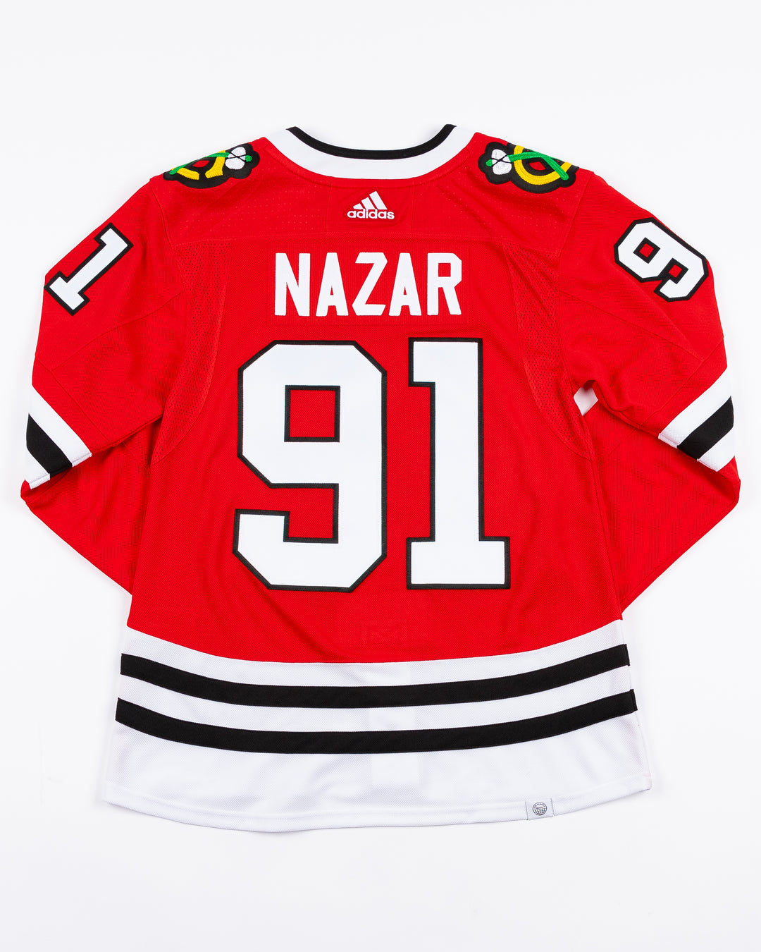 red adidas Chicago Blackhawks hockey jersey with stitched Frank Nazar name and number - back lay flat