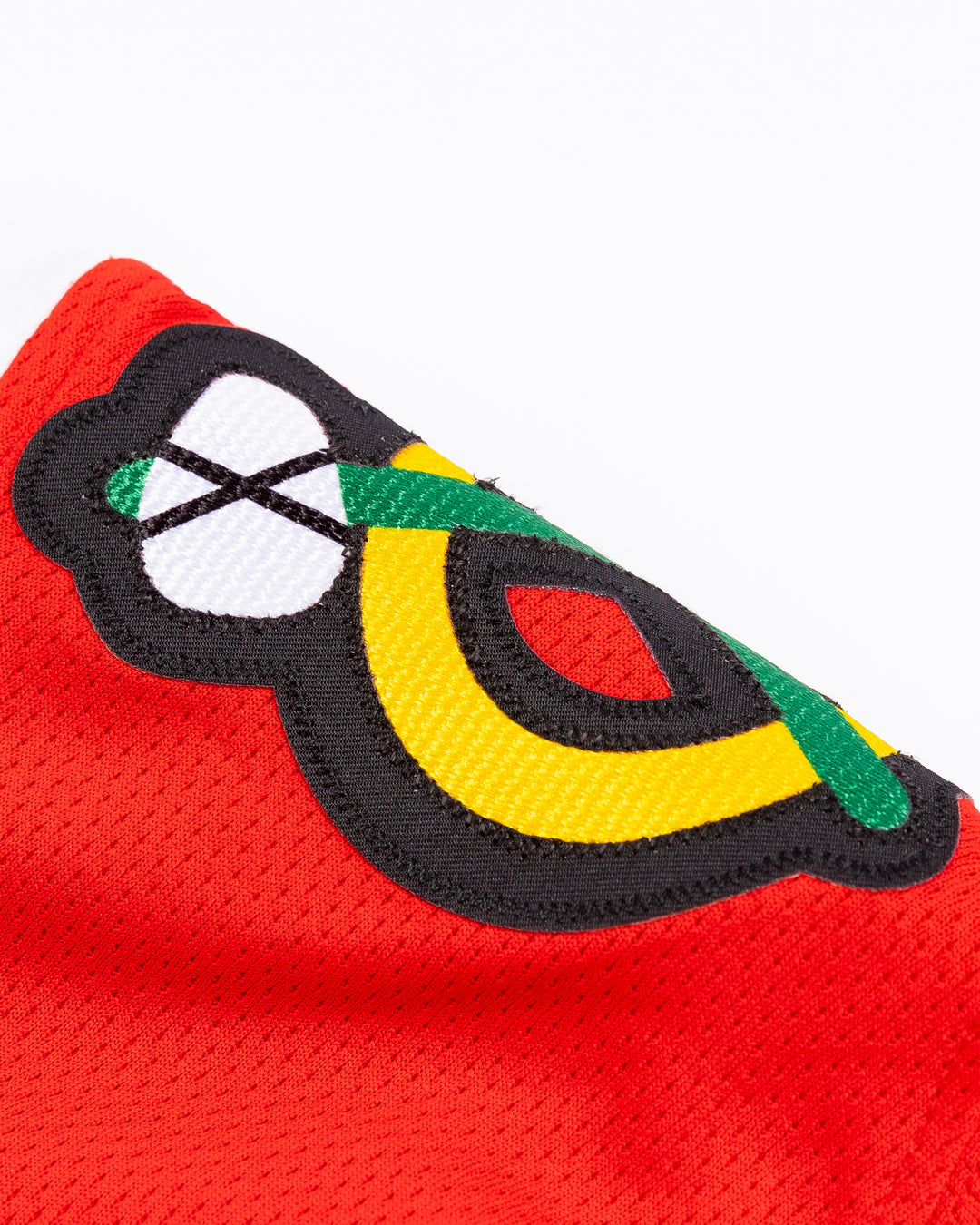 red Fanatics Chicago Blackhawks jersey with stitched Kevin Korchinski name and number - alt shoulder detail lay flat