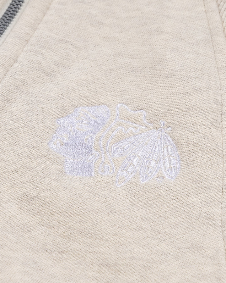 cream lululemon half zip with Chicago Blackhawks primary logo embroidered on left chest - front detail lay flat 