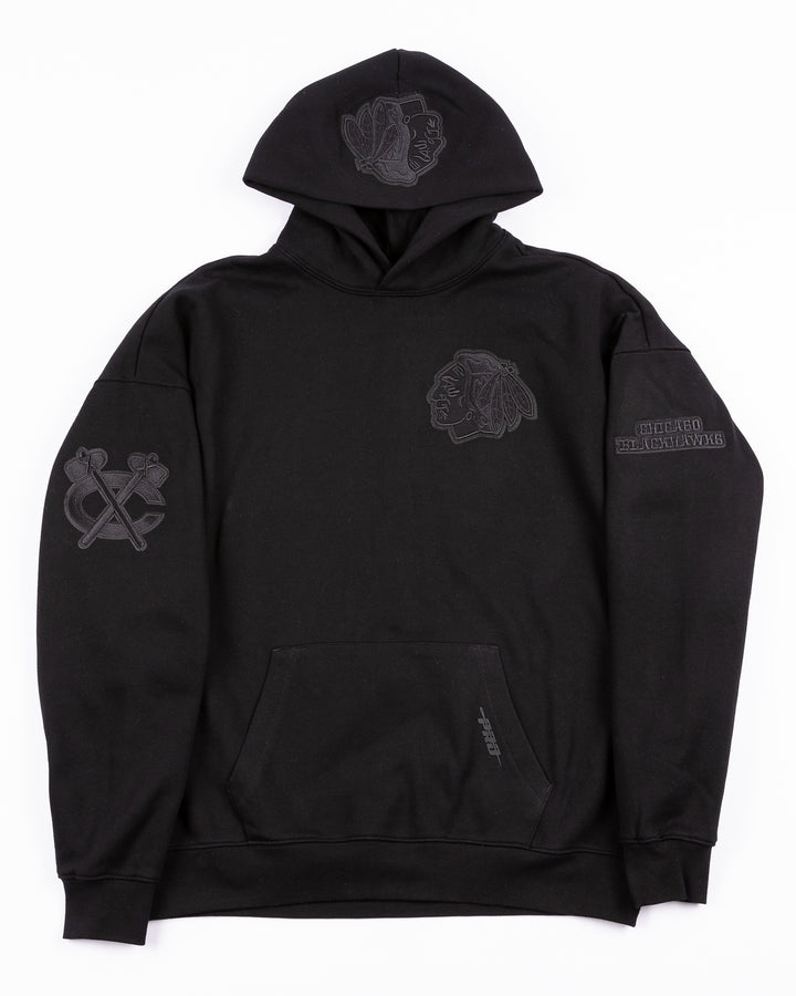 black Pro Standard hoodie with tonal Chicago Blackhawks patches throughout - front lay flat