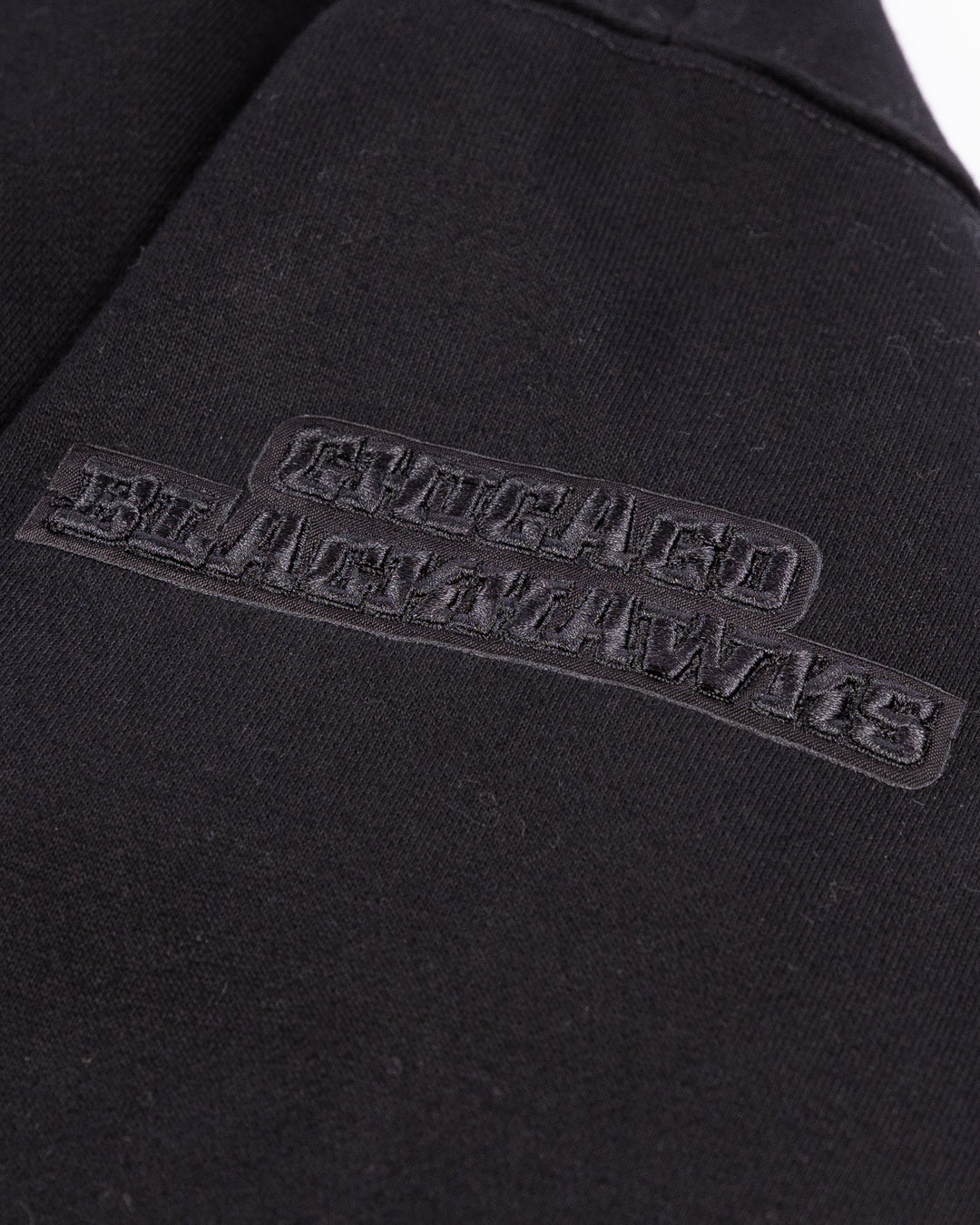 black Pro Standard hoodie with tonal Chicago Blackhawks patches throughout - arm patch detail lay flat