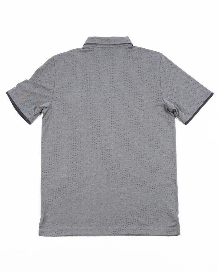 grey TravisMathew polo with Chicago Blackhawks tonal primary logo on left sleeve - back lay flat