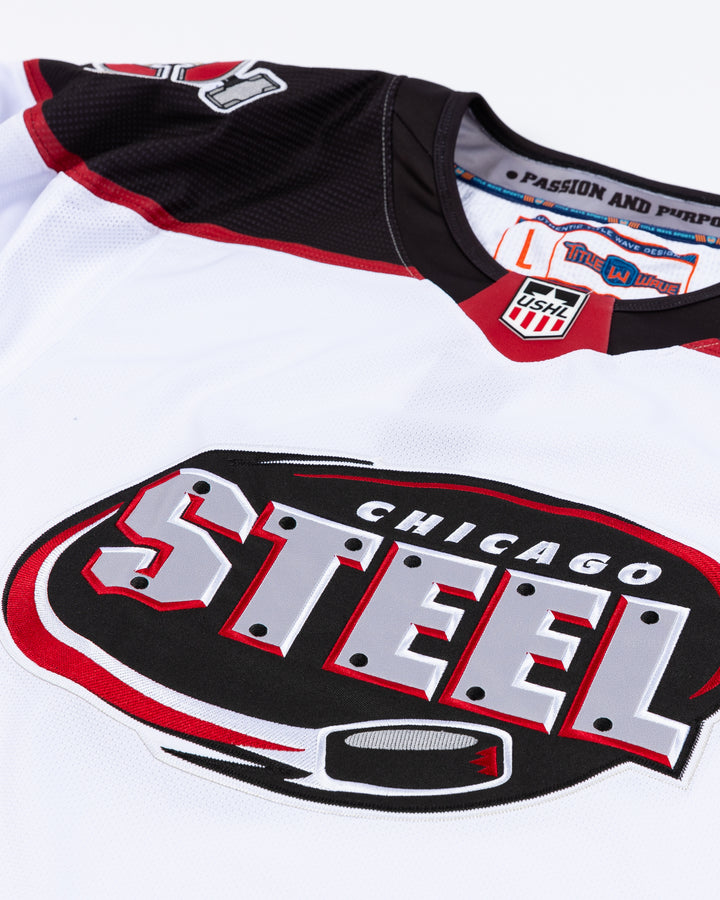 white Chicago Steel replica hockey jersey - front detail lay flat