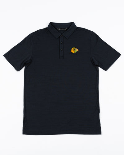black TravisMathew polo with Chicago Blackhawks primary logo embroidered on left chest - front lay flat