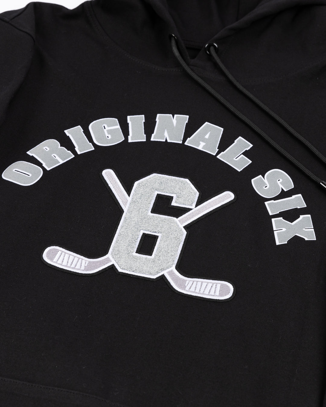 black Pro Standard Chicago Blackhawks hoodie with Original Six NHL team patches embroidered on arms - front detail lay flat