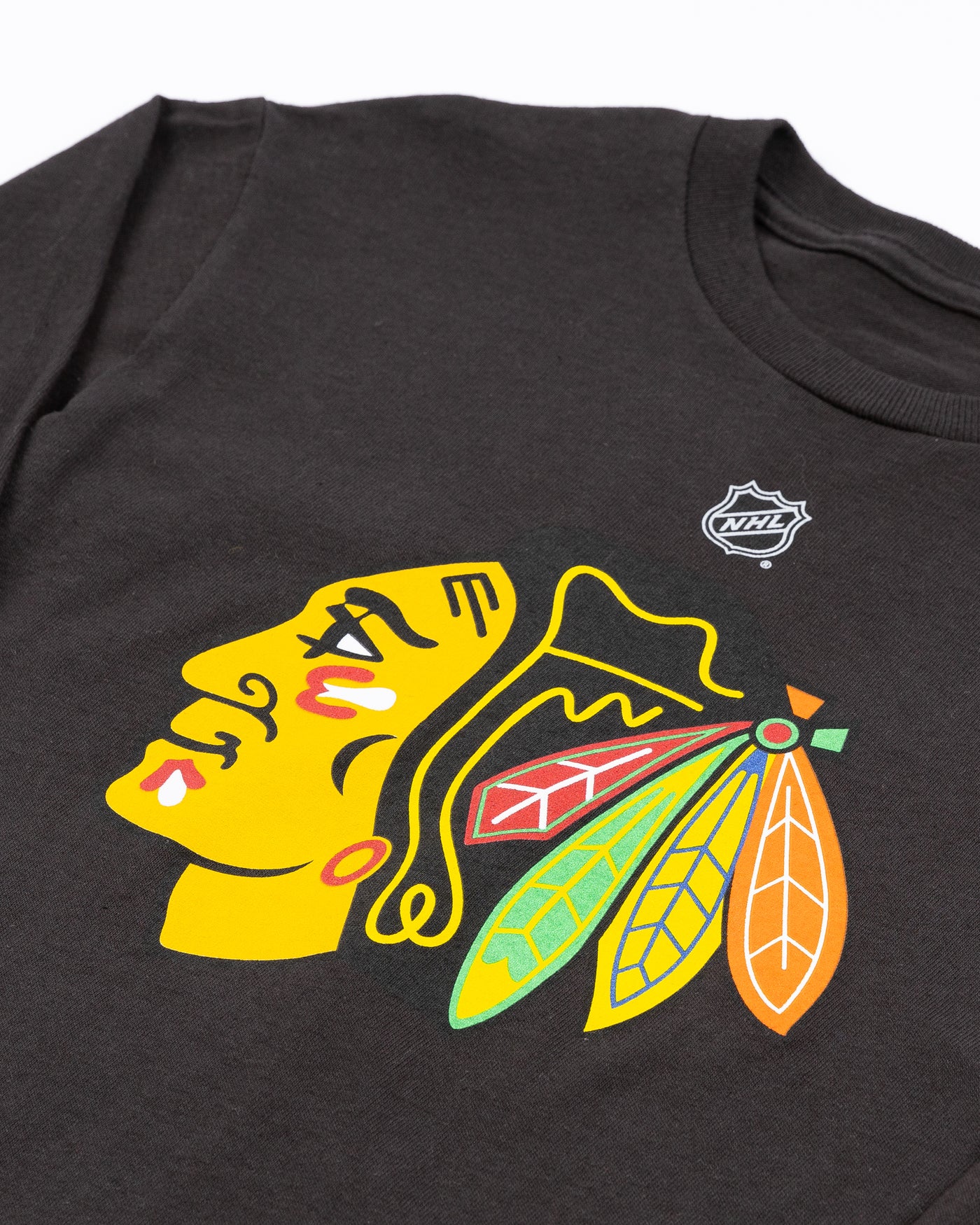 black Chicago Blackhawks youth long sleeve tee with primary logo across front - detail lay flat