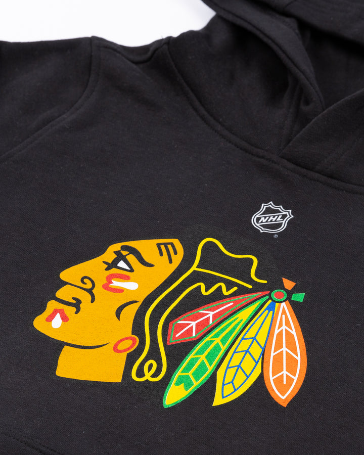 black youth Outersuff hoodie with Chicago Blackhawks primary logo across front - detail lay flat