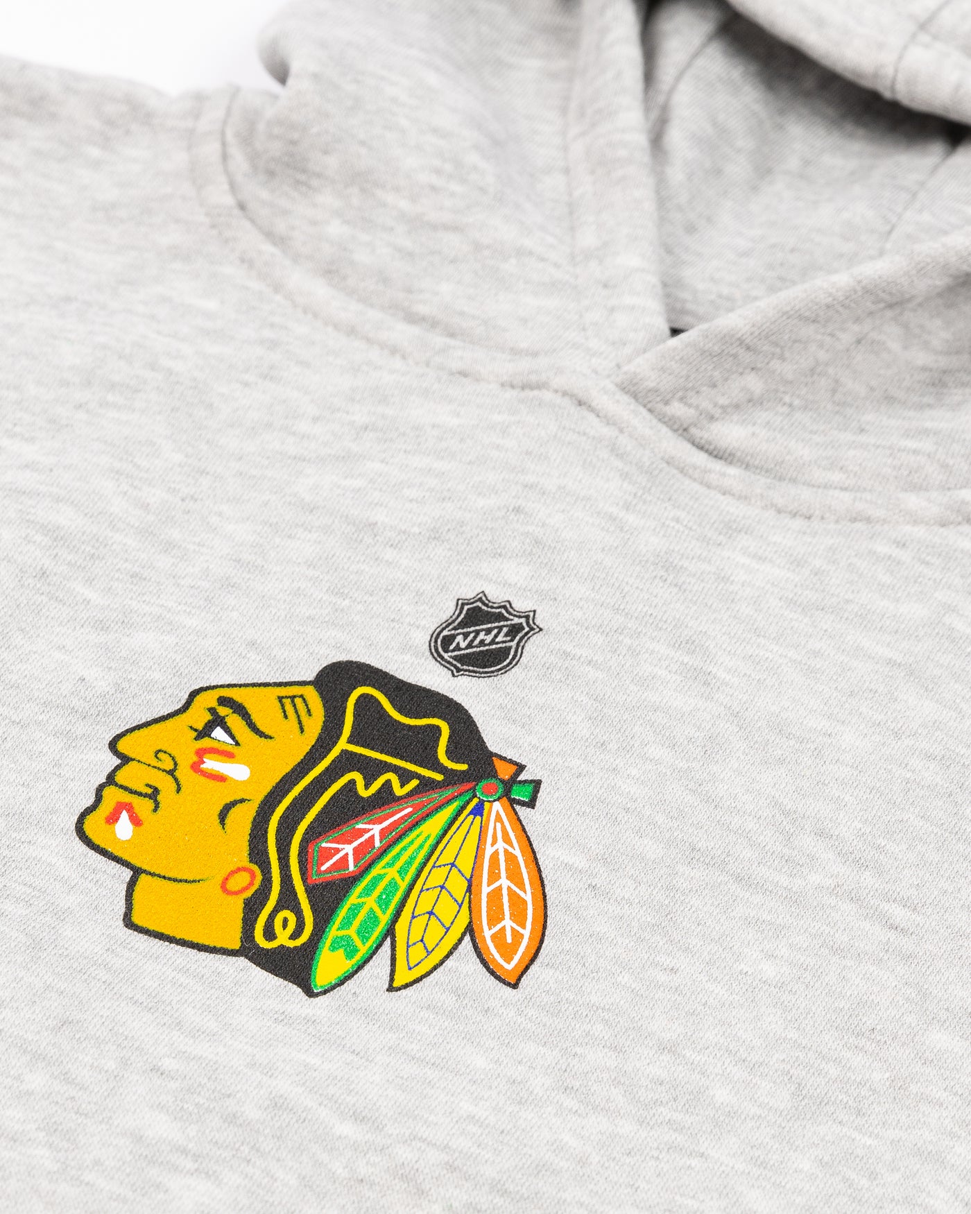 grey kids Chicago Blackhawks hoodie with primary logo across front - detail lay flat