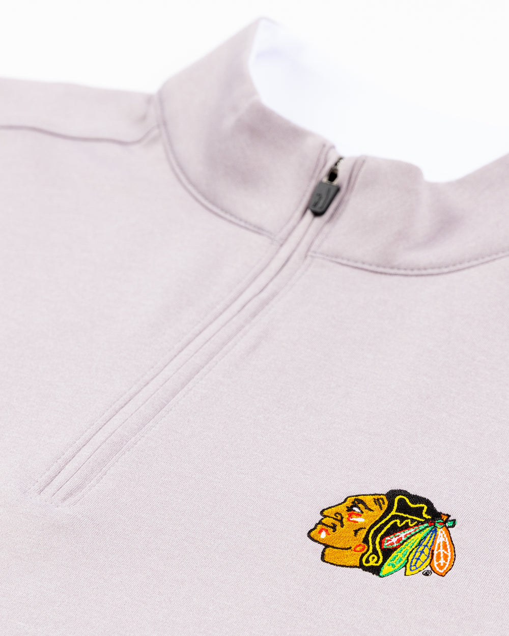 light grey johnnie-o quarter zip with embroidered Chicago Blackhawks primary logo on left chest - detail lay flat