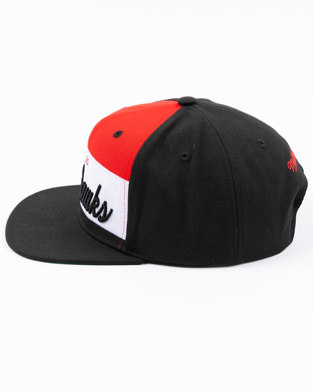 black white and red Mitchell & Ness snapback cap with Chicago Blackhawks wordmark on front and primary logo on right side - left side lay flat