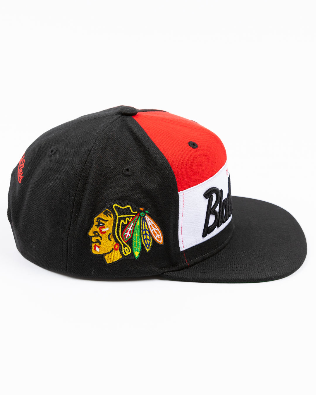 black white and red Mitchell & Ness snapback cap with Chicago Blackhawks wordmark on front and primary logo on right side - right side lay flat