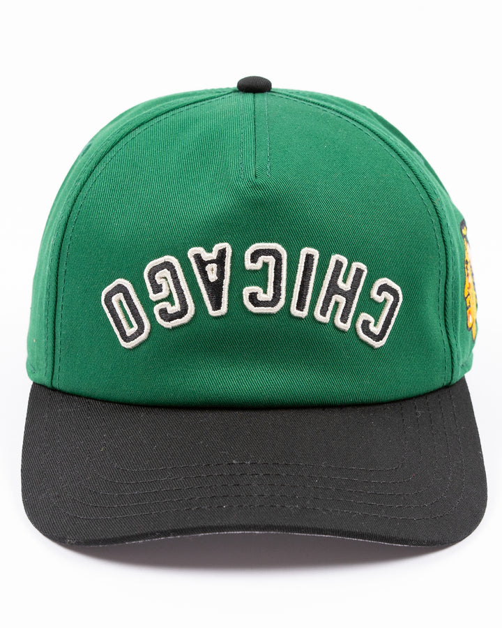 American Needle Roscoe snapback cap in green and black with upside down Chicago wordmark on front and Chicago Blackhawks primary logo on left side - front lay flat