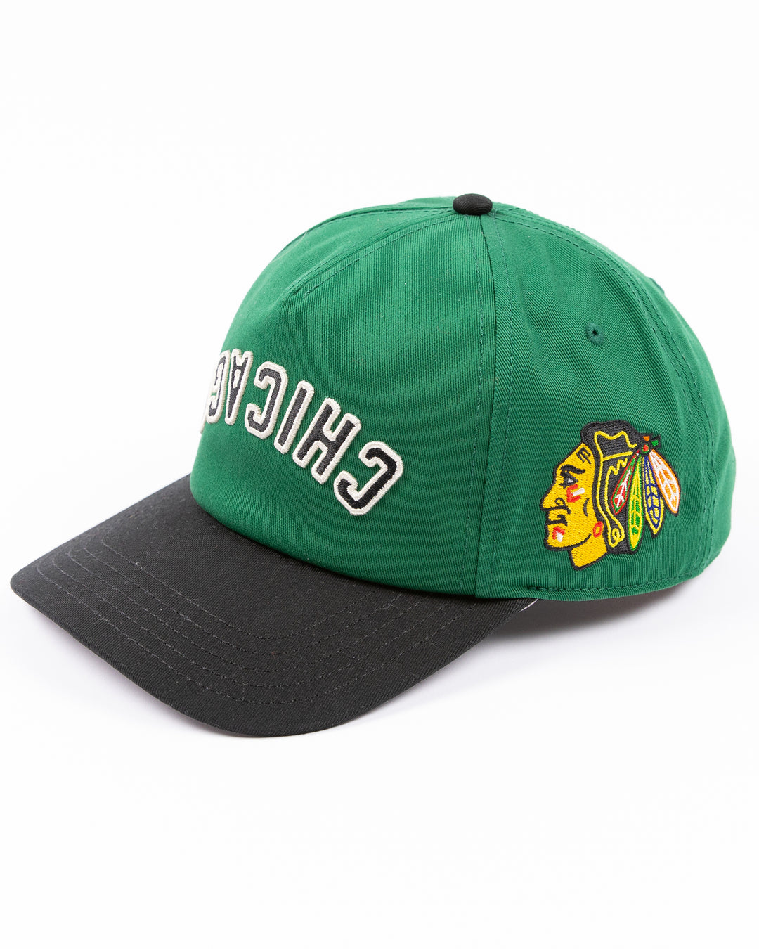 American Needle Roscoe snapback cap in green and black with upside down Chicago wordmark on front and Chicago Blackhawks primary logo on left side - left angle lay flat