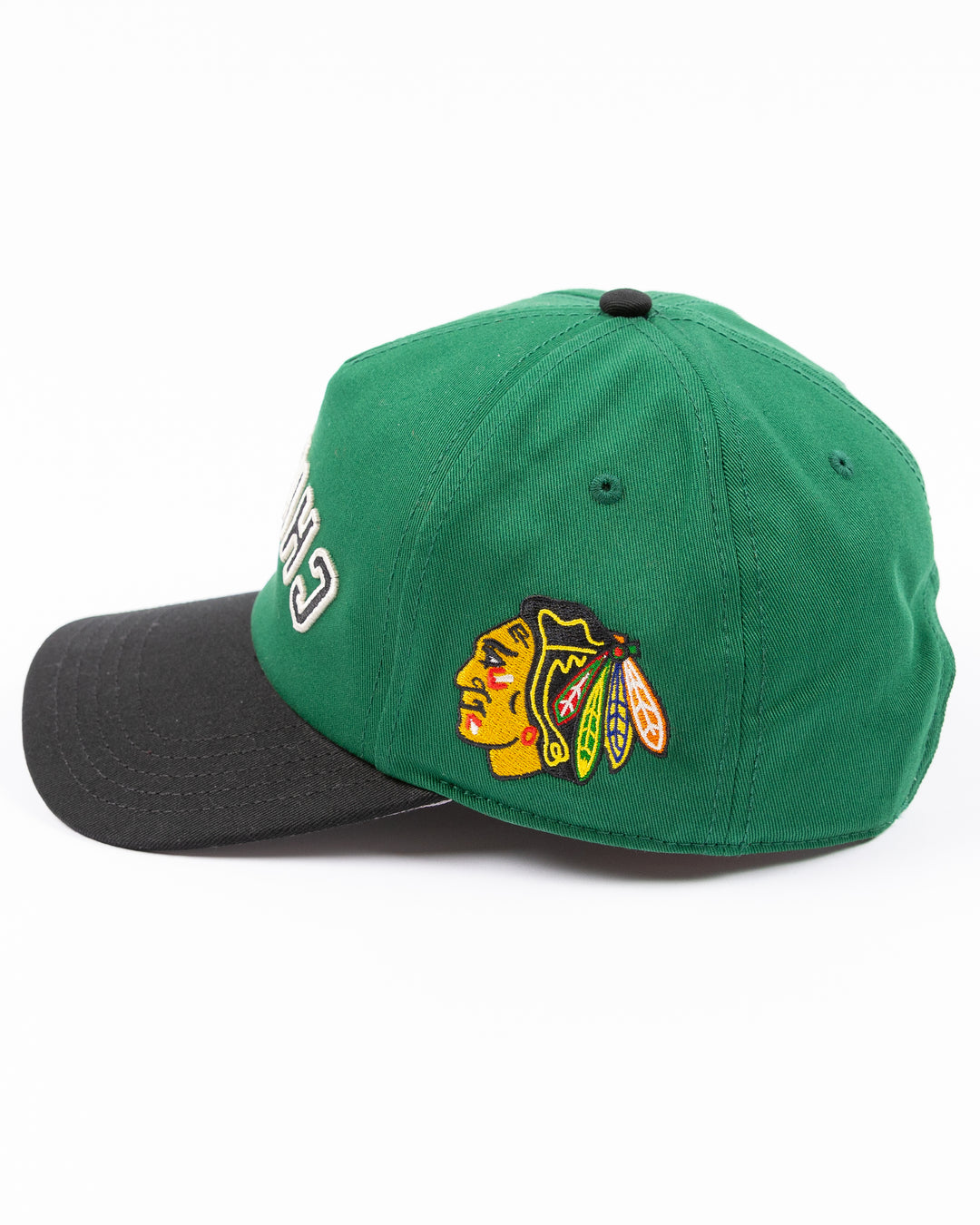 American Needle Roscoe snapback cap in green and black with upside down Chicago wordmark on front and Chicago Blackhawks primary logo on left side - left side lay flat