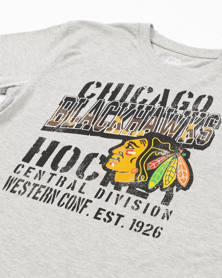 grey youth short sleeve tee with Chicago Blackhawks camo wordmark and primary logo graphic on front - detail lay flat