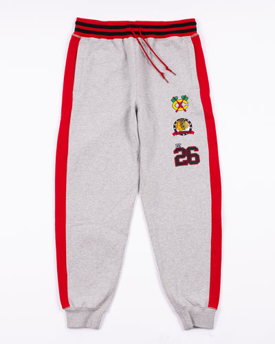 grey New Era sweatpants with embroidered Chicago Blackhawks logos and 26 on left leg - front lay flat