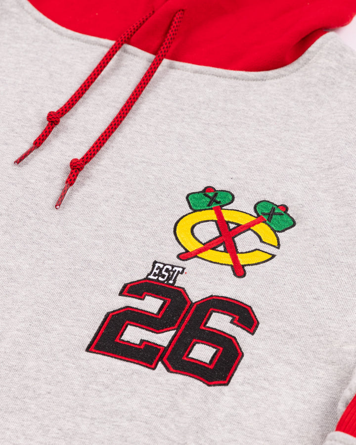 grey and red New Era hoodie with embroidered Chicago Blackhawks secondary logo and 26 on left chest - detail lay flat