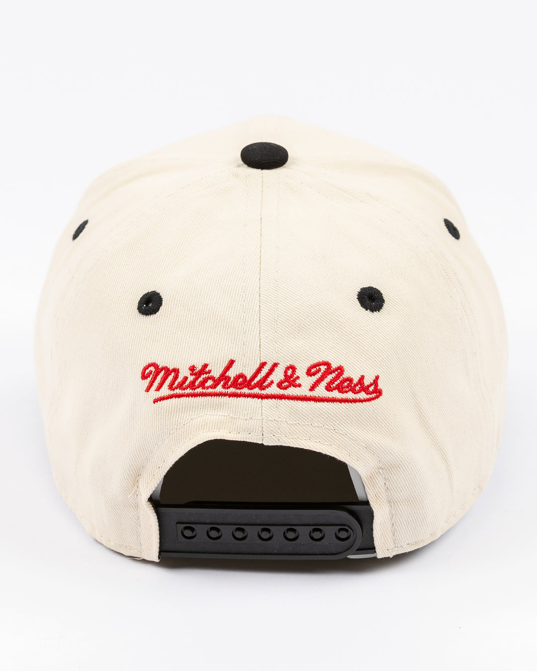 youth cream and black Mitchell & Ness snapback cap with Chicago Blackhawks wordmark and primary logo on front - back lay flat