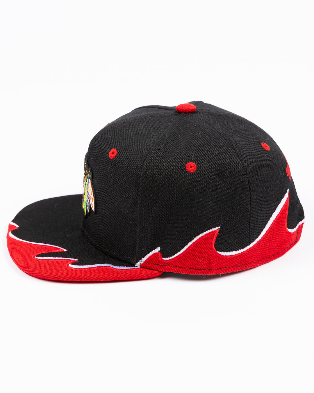 youth black MItchell & Ness snapback cap with Chicago Blackhawks primary logo on front and tide design embroidered on brim and left side - left side lay flat