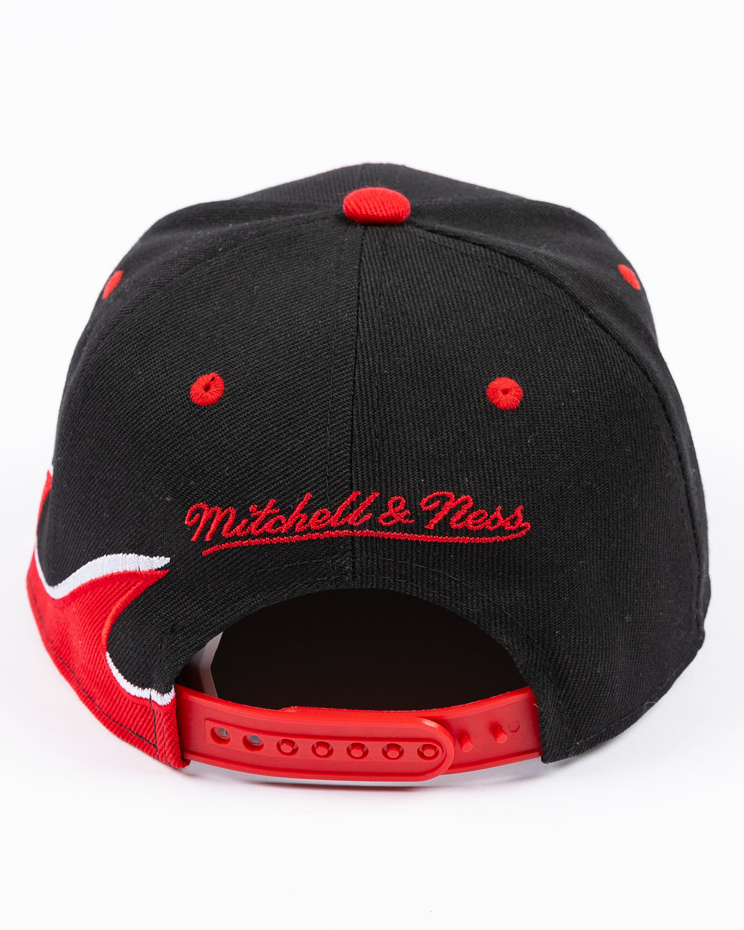 youth black MItchell & Ness snapback cap with Chicago Blackhawks primary logo on front and tide design embroidered on brim and left side - back lay flat