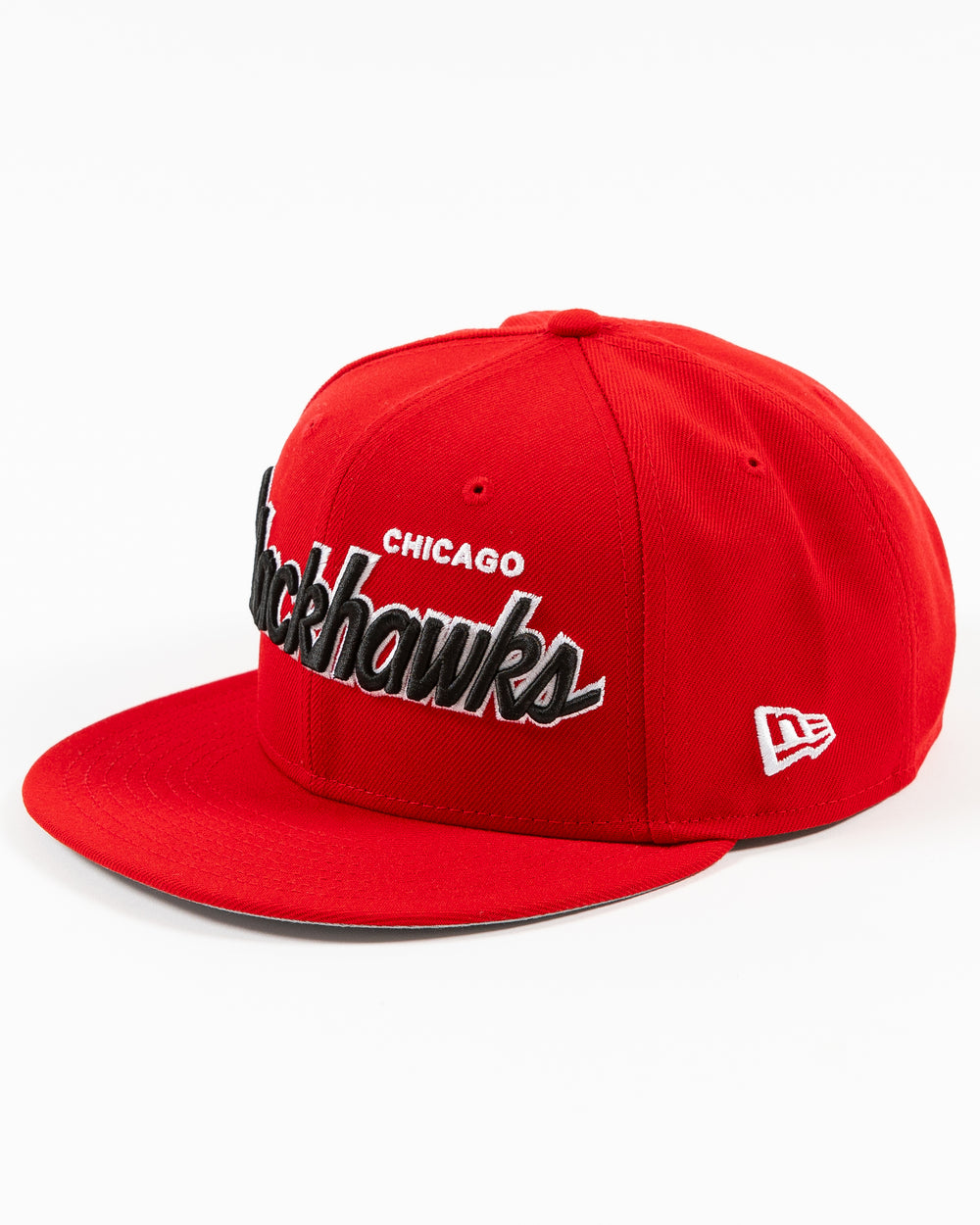 red New Era 9FIFTY snapback cap with Chicago Blackhawks wordmark on front and primary logo on right side - left angle lay flat