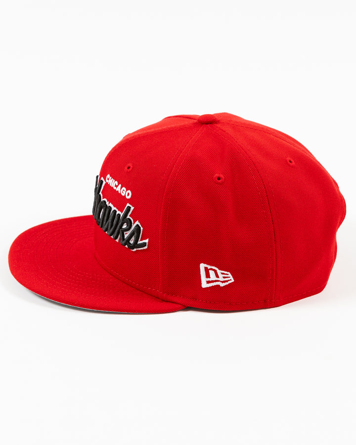 red New Era 9FIFTY snapback cap with Chicago Blackhawks wordmark on front and primary logo on right side - left side lay flat