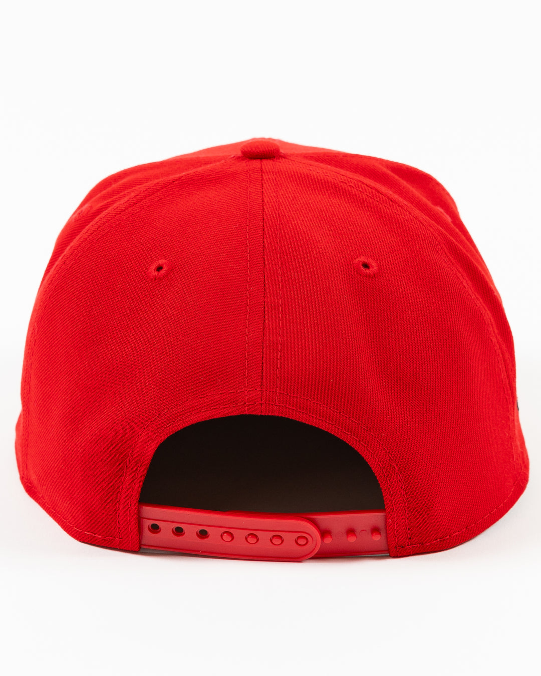 red New Era 9FIFTY snapback cap with Chicago Blackhawks wordmark on front and primary logo on right side - back lay flat